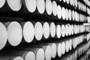 stacked aluminum round bars on a shelf