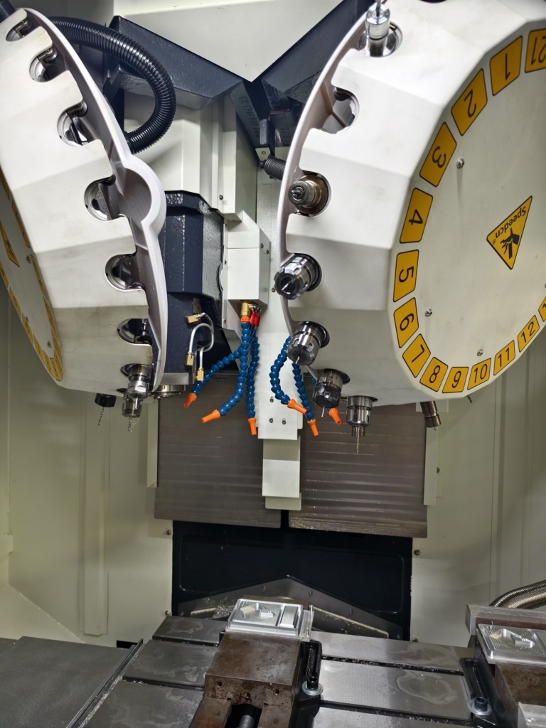 Precautions for automatic tool change in a twin-spindle machining center