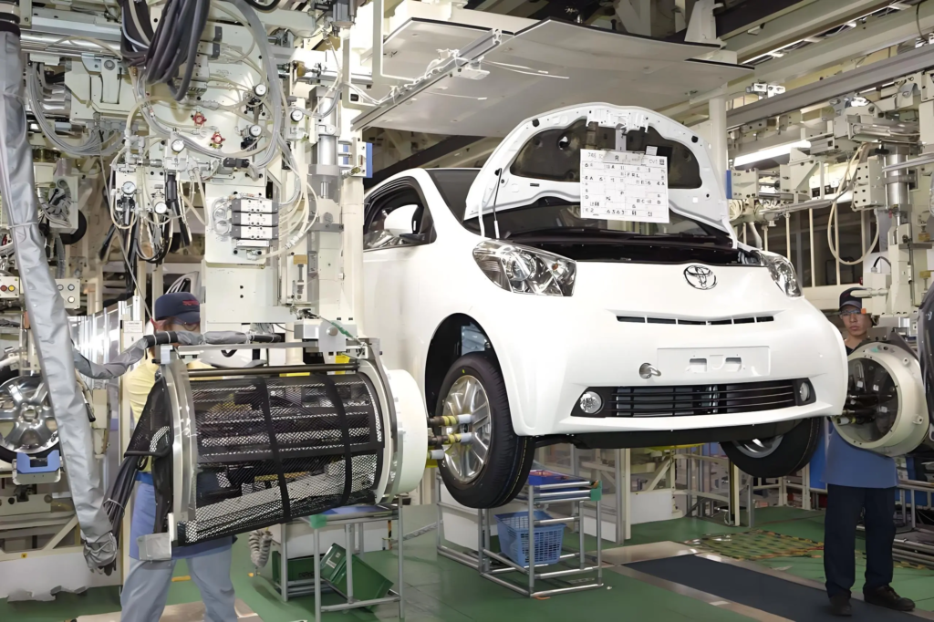Toyota Electric Car Uses Cnc Processing Technology Extensively1 1 Workers assembling a car in automobile factory