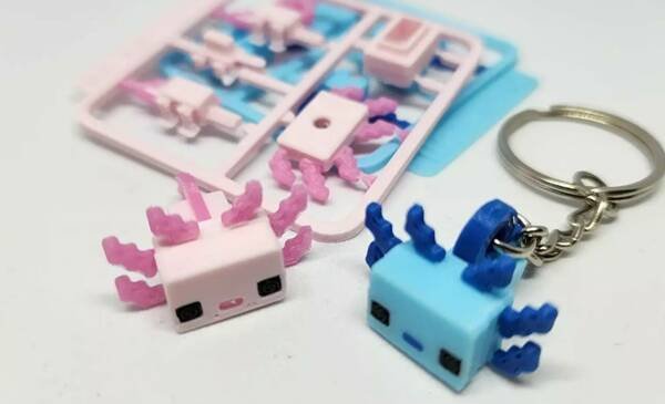 Multi-part axolotl keychain design showing printed parts and assembled result