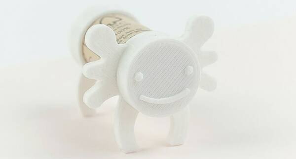 Pair of 3D printed axolotl figures designed to clip onto standard wine corks
