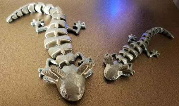 A highly detailed, multi-jointed axolotl 3D model posed dynamically