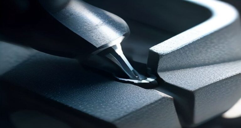 CNC Machines Online — Close-up of a CNC end mill cutting aluminum, metal chips curling away under coolant spray